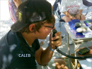 Caleb from Guthrie OK is pictured here picking up contacts on the GOTA station. Note that his cell phone is on the table--he had been texting his girlfriend and put the phone down for about 3 hours while he made his first ever 20 HF contacts.